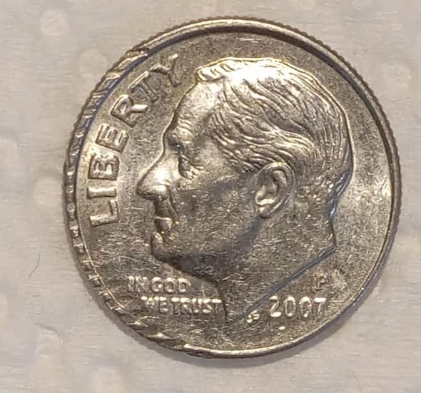 2007 Roosevelt dime partial collar error with distinctive stepped rim where metal squeezed outside the retaining collar during striking